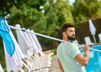 Pool Maintenance Guy with Long Pool Net